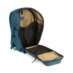 20L Transport Backpack (Wander Blue) with open compartment showing Coyote interior on a white background / Wander Blue